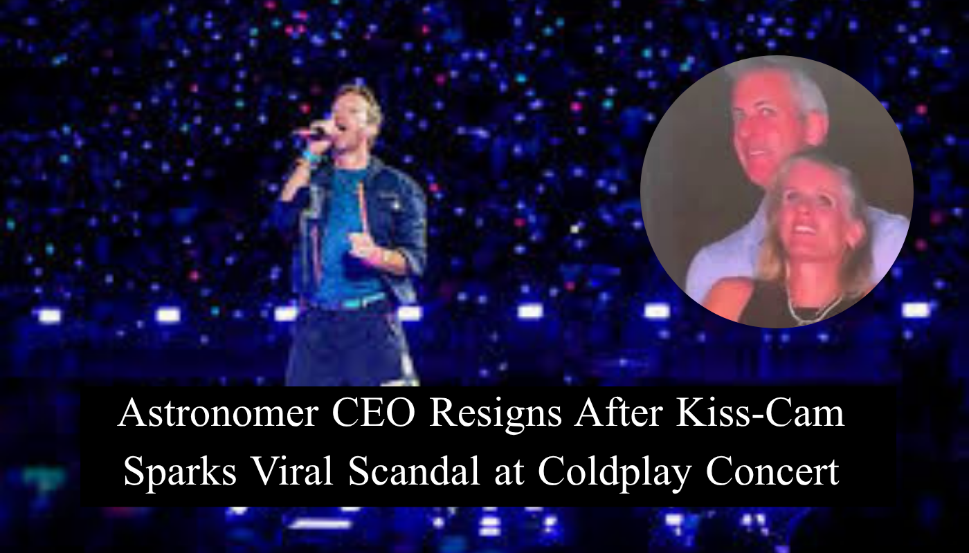 A concert crowd at night with a giant screen showing a kiss-cam moment during a Coldplay performance.